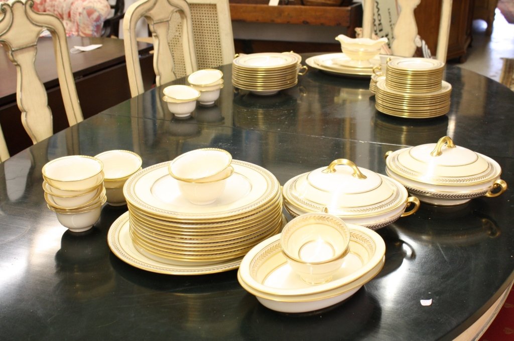 Porcelain Lenox Dinner set Each Numbered: Each plate signed Lenox, Made in USA and trademarked. Each plate Signed and numbered. Pattern in pale lemon yellow and gold leaf. Set includes twelve dinner plates, one medium sized oval platter, one 
