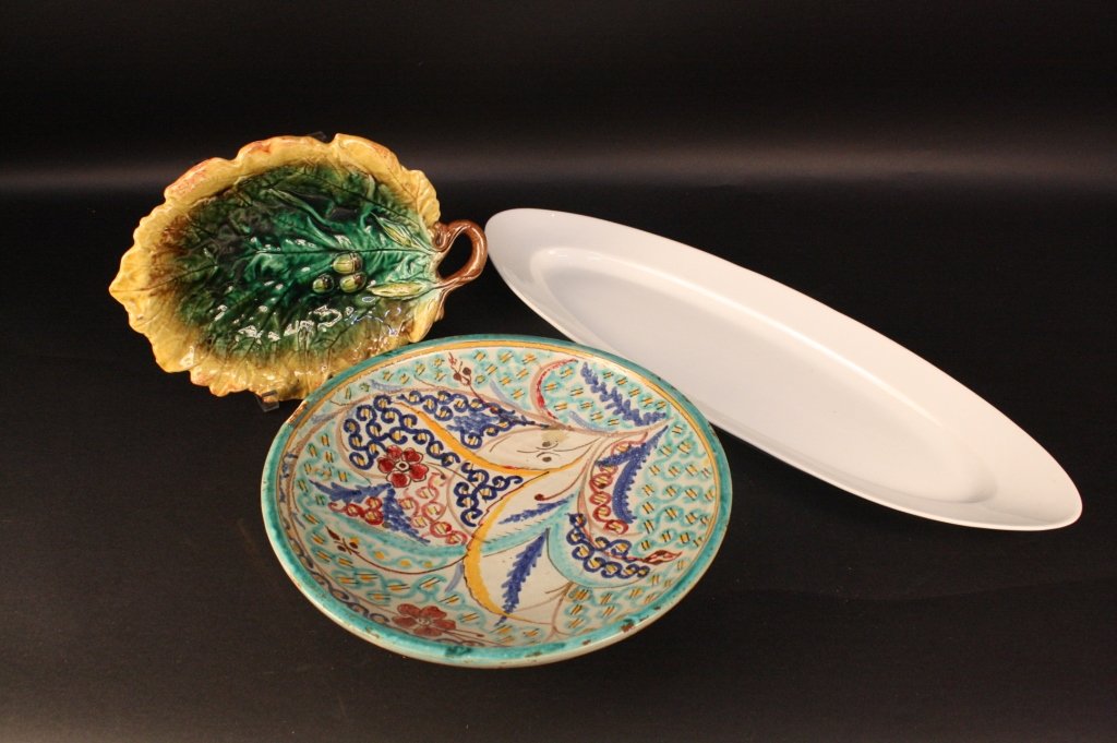 Pottery Group Lot Majolica: Majolica plate in bright green and yellow with leaf and acorn motif, one large ironstone fish platter, and large hand painted ceramic bowl. Longest measures 25 inches. Diameter of bowl 12.5 inches. Pr