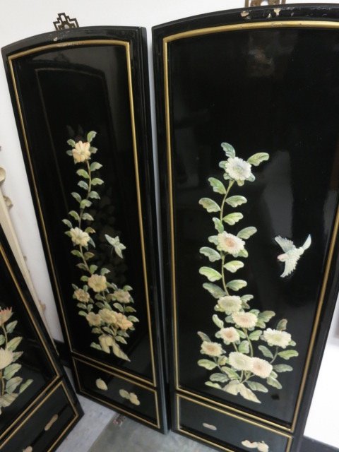 4 Panel Asian wood Wall hanging: four separate Asian Panels with Brass mounts and trim. Hand painted on ebonized wood. On top of wood is sculpted carved and applied design with flowers and vines, and gold painted wood trim. Height of