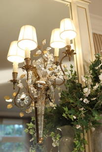 P.E.Guerin Pair Crystal Parrot Sconces: Pair of hand crafted Crystal Parrot Sconces, French Design Each with two arms, Parrot atop a decorative mount with sprigs of leaves and flowers. Purchased at P.E. Guerin Showroom NYC # 81030.