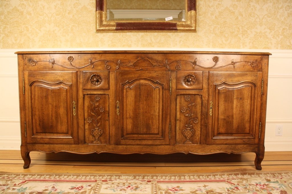 Provincial Louis XV Style Fruitwood Sideboard: Purchased at Doyle Auctions 2004 $2600. French carved side board in French Provencal style with carved birds and borders. Measures Length 77 inches, height 38 inches, Depth 20 inches. Property of a Be