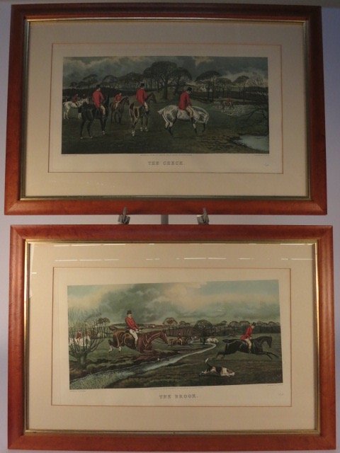 Two English Fox Hunt Hand-colored Prints: Birdseye Maple Framed with gold leaf and professionally matted. Each stamped and numbered. The Creek 111/200 and The Brook. Engraved by C.B Stock. LAE LTD Editions, London. Each measures 34 inches W x
