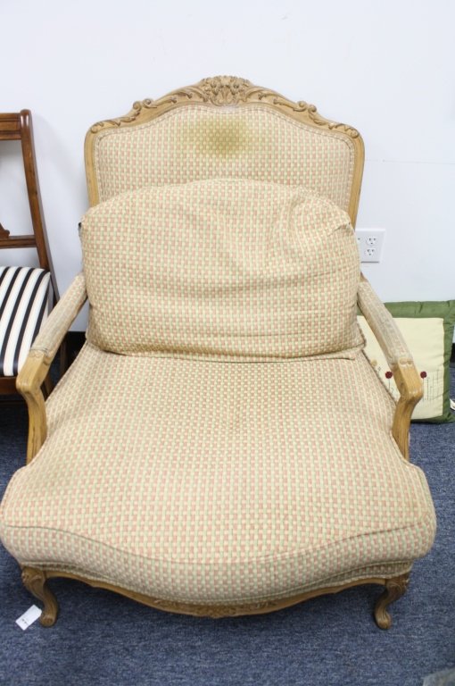DREXEL HERITAGE Upholstered French Style Bergere: Measures 38 Inches high by 32 inches wide by 32 inches long carved frame cabriole feet and open arms upholstery has stain on back. Property of Ridgefield Estate.