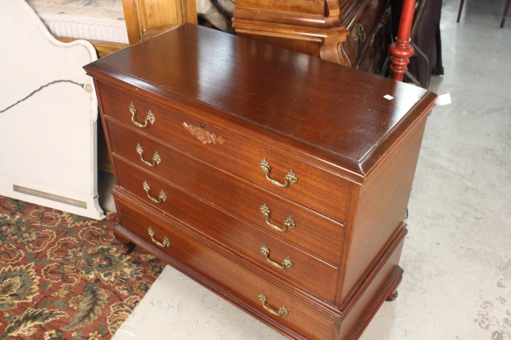 West Branch Cedar chest dresser: West Branch Novelty Company Cedar Chest. Chest Appears to be a Dresser, with a hinged top. Cedars wood with Ogee bracket feet. Measures 30.5 inches high by 34.5 inches wide by 17 inches deep. Property