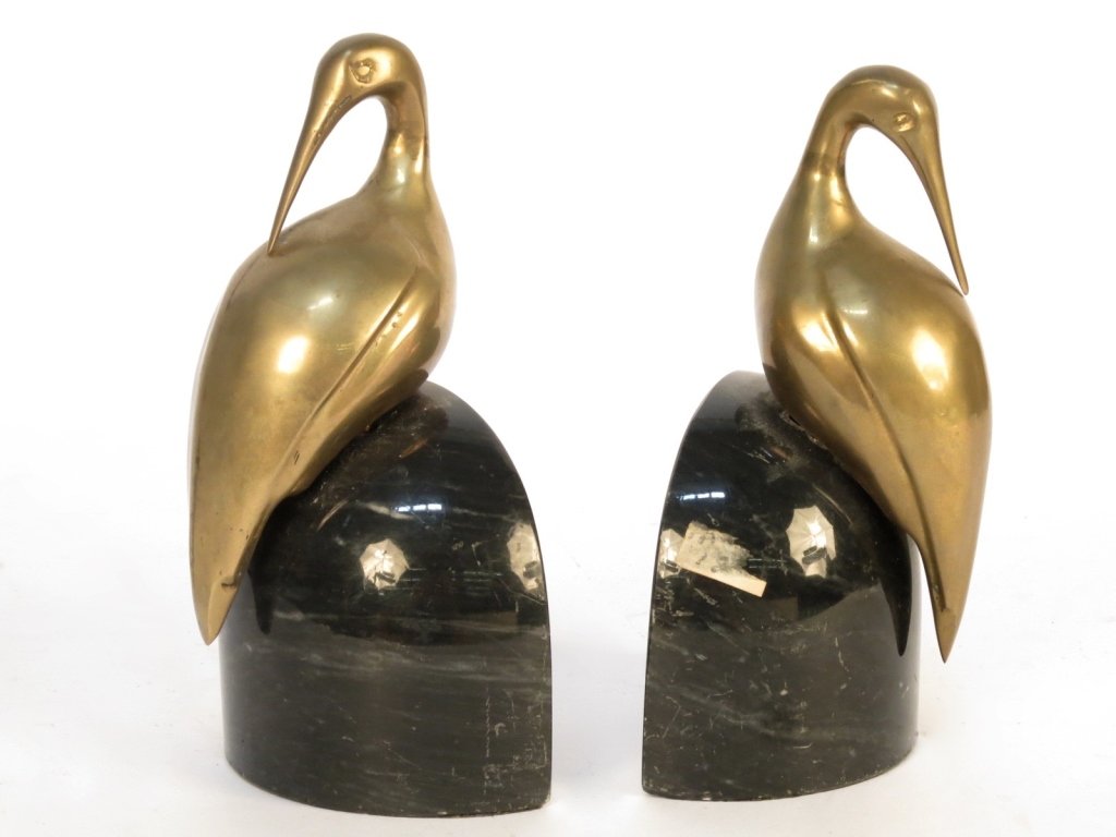 Marble Brass Bird Book Ends: Pair of book ends with removable mid century modern brass birds perched with rods into polished quarter circle marble bases. Each measures 8 inches high 5 inches wide Decor