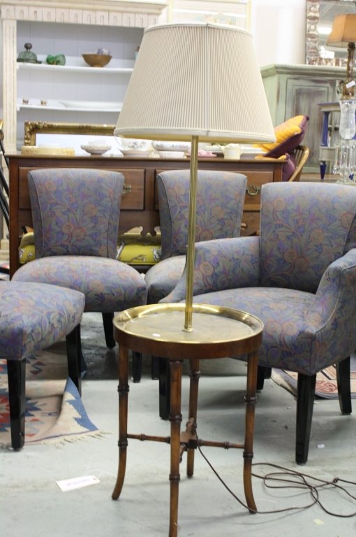 Etched brass lamp table: Intricately etched brass surface and fluted brass lamp attachment to lamp table. Brass wood legs and stretcher base. Meassures 16 inch diameter 52 inch height. Property of Harrison Estate