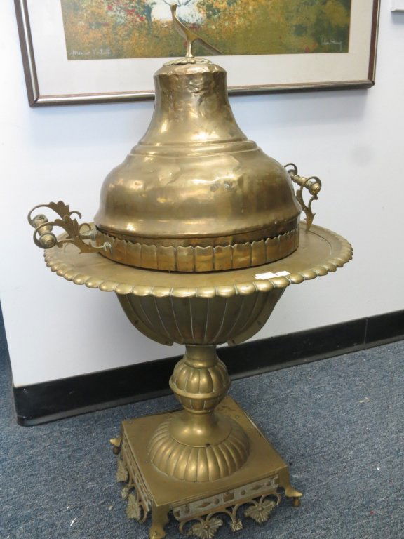 Antique BrassCooking Serving Vessel on stand: Possibly Middle Eastern Antique Circa 1900's Brass Cooking Vessel lidded handled cover on Pedestal base with bowl. Very Decorative.Measures 34 inches high and 20 inches wide.