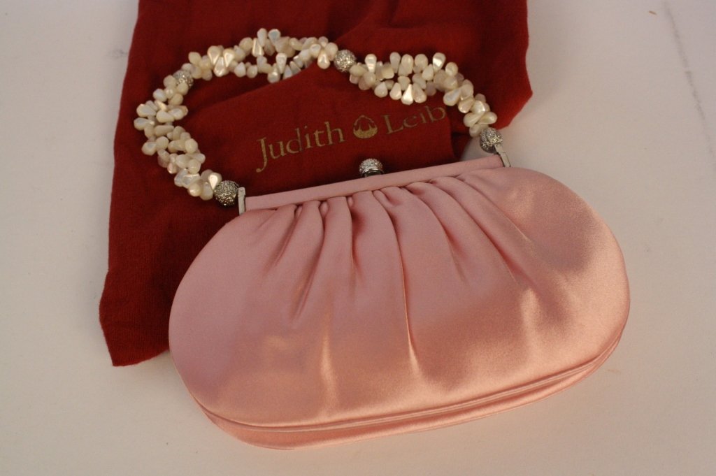 JUDITH LEIBER Pink Satin Pearl Evening Bag: Never used bag with original paperwork in original pouch. Includes mirror, comb and change purse. No. 18858 . Property of a Northern Westchester Clothes Designer.