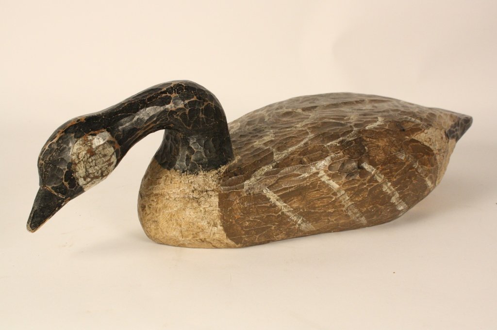 Large Wooden Goose Sculpture FOlk art: Goose sculpture Hand carved wood folk art piece. black neck and head with painted body. Measures 28 inches length and 12 inches width.