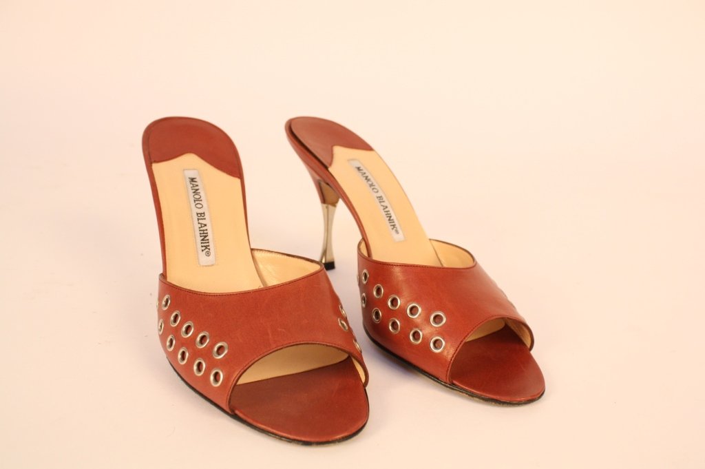 MANOLA BLAHNIK Red Sandals with Grommets: Slip on sandles with silver 3 inch heel. Size 38.5/8.5 USA. Gently worn.