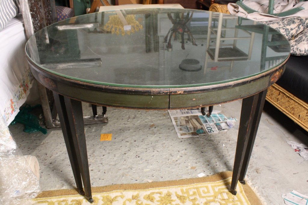 Antique Hand painted Black Dining Table w5 chairs: four twin legs on casters. Hand painted black round table. Hand painted floral design. 52 inches diameter. 4 leaves 11 inches each. Expands to 96 inch oblong or oval dining table.