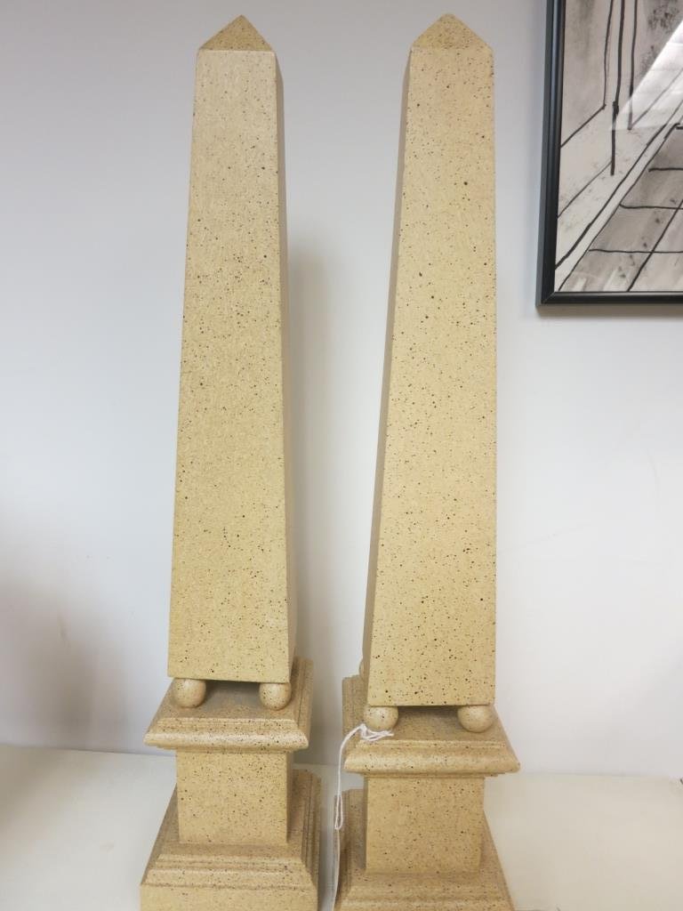 Pair of Faux Marble Obelisks: Pair of faux marble style obelisks . painted composite. Very decorative. Each measures 19 inches high