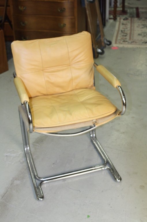 Mid Century Chrome Leather Lounge Chair c. 1970s: A mid century chrome and leather lounge chair c. 1970s. some ware. Tear to burlap area under cushion, could be repaired by upholsterer. also some surface ware. otherwise in nice condition. measures 22