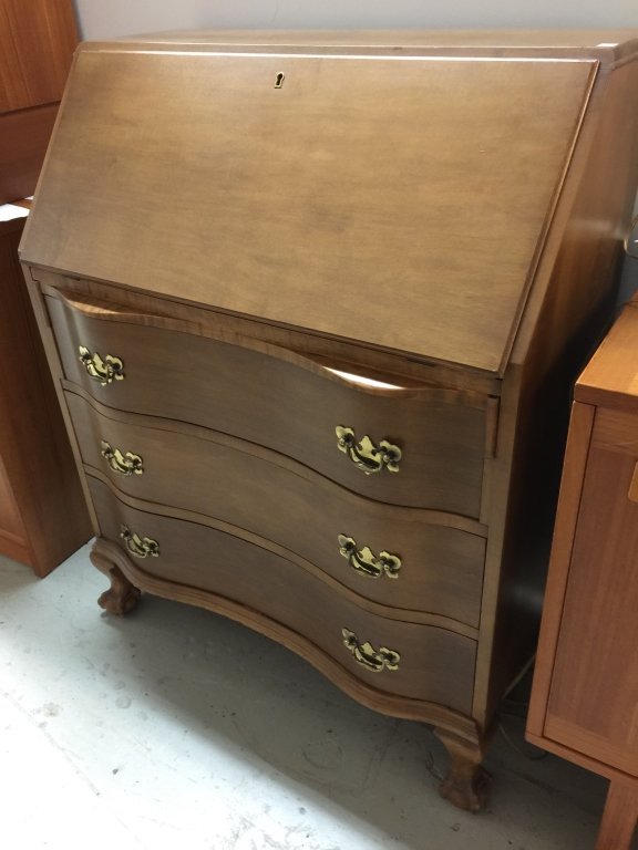 Vintage Secretary Desk: A vintage flip top secretary. Has multiple compartments and drawers. Measures 31 1/2w x 17d x 40h.