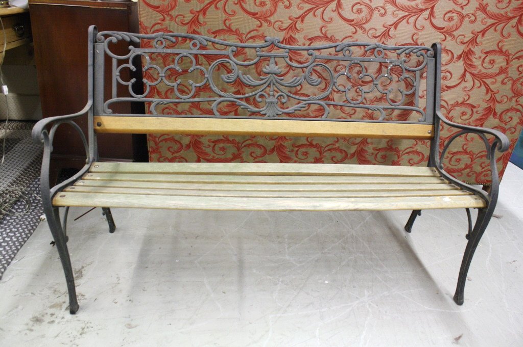 Antique Wood and iron bench: Antique wood and iron Bench. Outdoors or indoors. Measures 48 inches 38 inches height by 21 inches deep. Thick hand wrought iron back in quadra-foil and scroll design. Iron armrests and feet.