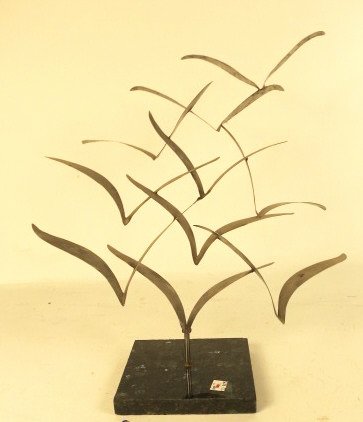 Metal Sculpture of a Flock of Birds in Flight: on a marble base. Signed Manfred Segman (sp?) Steel medium.