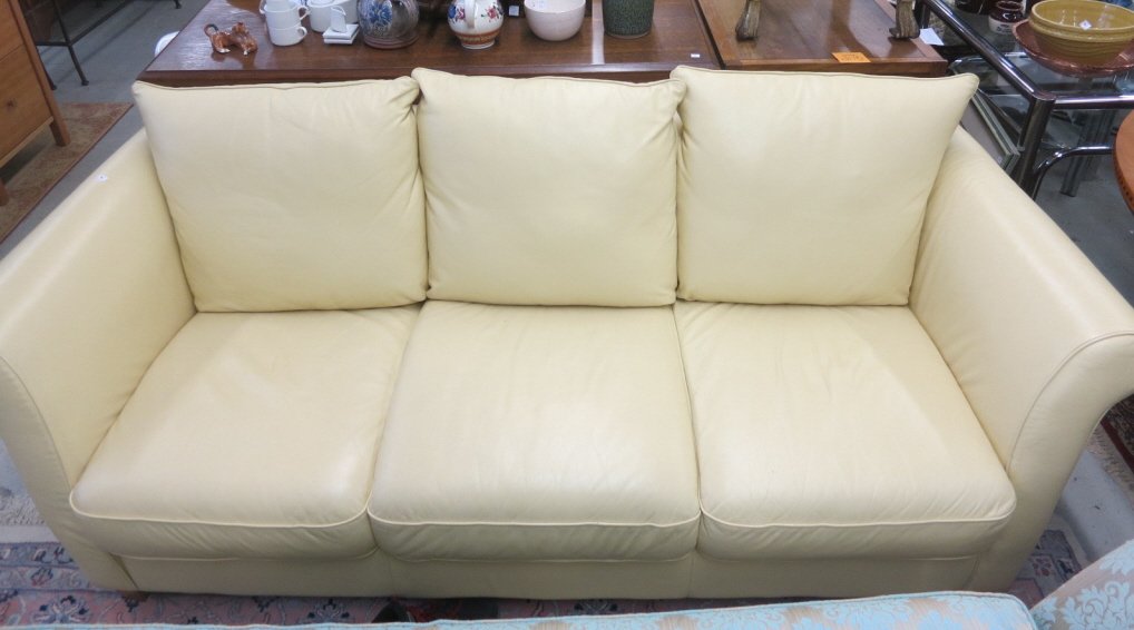 Italian Supple Leather Chamois Color 3 Seat Sofa: Very good condition. Pillows zipper attach to the back of the couch. Measures 80 inches x 27h x 34d. ID. NBR. 1999/391742/001. Property of a Scarsdale Estate.