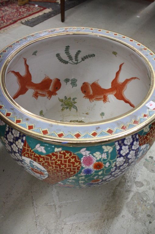 Coy Pot: Colorful pot, oriental design, inside design coy fish, outside design is a combination of colorful geometric and floral pattern, measures 14 inches tall by 17 inches in diameter