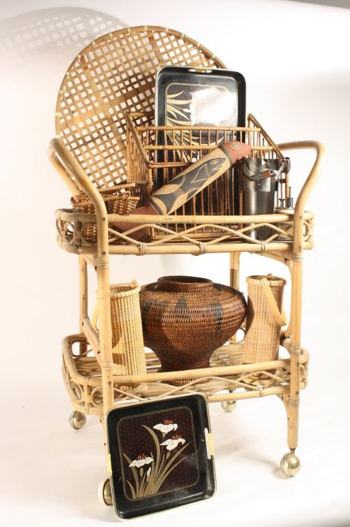 Rattan Bar Cart and Bar Accessories and Group of: six assorted whicker items, two black trays. Bar accessories include a hide ice bucket and sculpture wine bottle holder. Cart measures 35 H by 25 W and 17 inches D
