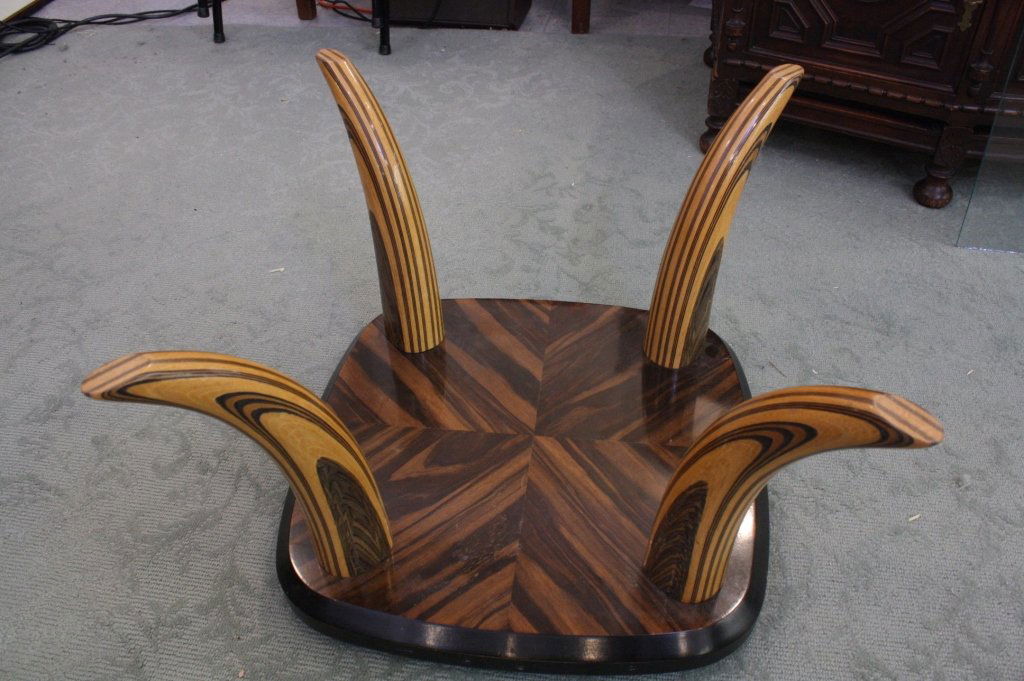 Vintage Hollywood Regency Tusk Coffee Table: A vintage Hollywood Regency laminated wood tusk coffee table c. 1970s/1980s. Made by Henredon. It has a very Karl Springer feel to it. measures 16 x 38 x 38.