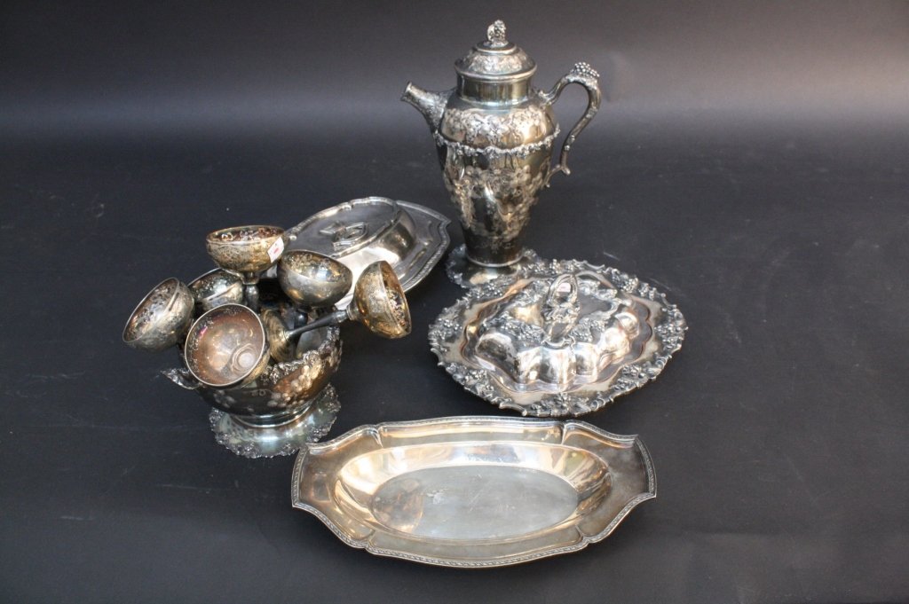 11 Piece Antique Silver Copper Style Lot: 11 piece antique silver style lot consists of 1 serving platter with matching lid marked GMCO EP 01099 10 1 with an ANCHOR mark and a TRUMPET mark on the bottom measuring in inches 4H X 13W X 9D, 1 se