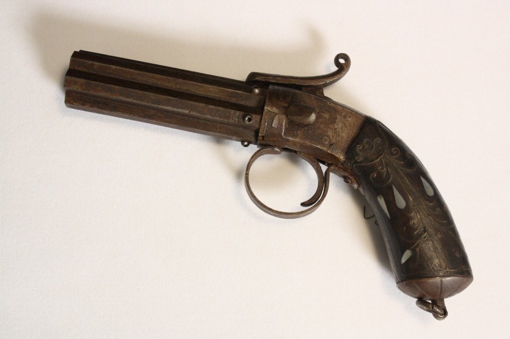 Antique Flintlock Pepper Box Pistol c. 19th c.: Antique flintlock pepper box pistol c. 19th c. Has 6 barrels and inlaid marble and metal wood handle. likely early to mid 19th c. Measures about 8 1/2 inches long.