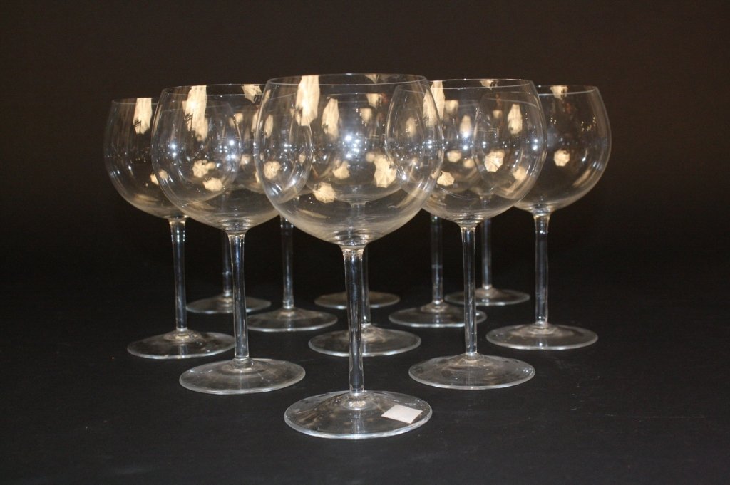 Set of 11 Wine Glasses: Set of 11 wine glasses, clear glass, thin at rim, circular cup design, measuring in inches 7H X 3.5D.