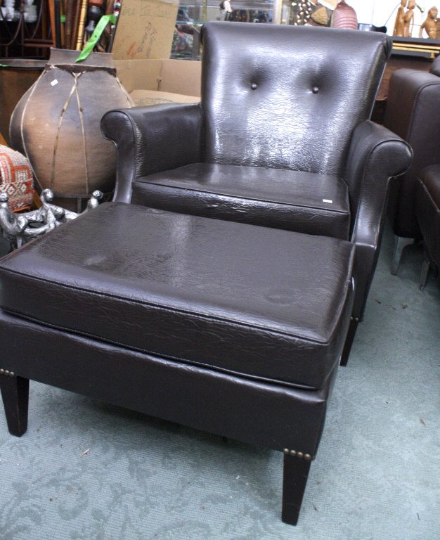 Pleather brown armchair with matching ottoman: Pleather brown arm chair with brass decorative tacks, 31'Hx30"Wx27"D with matching ottoman 15"Hx23"Wx17D