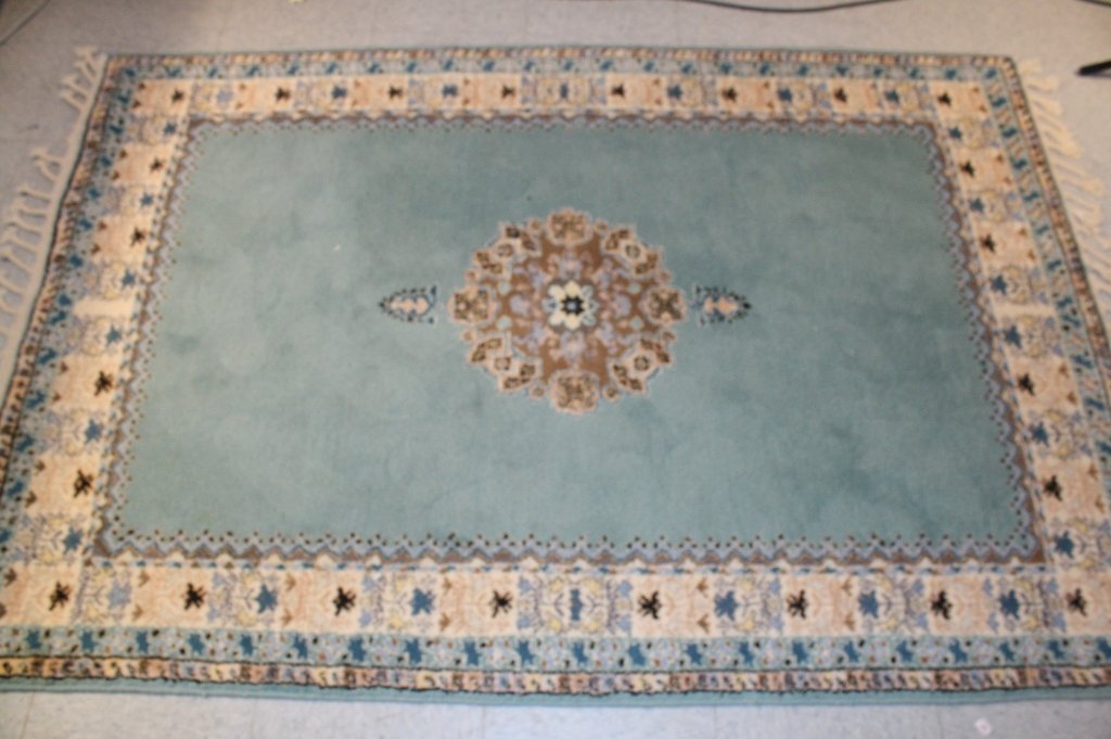 MOROCCO Artisan Teal Carpet: Morocco artisan made teal carpet with light braided fringe on two sides with middle design and border edge design and teal color main, measuring in inches 70L X 48W.