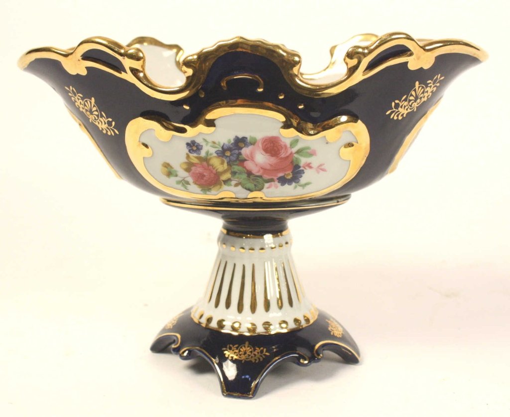 Limoges Style Pedestal Centerpiece: Floral motif, primarily blue, white and gold. Measures approximately 10 inches h.