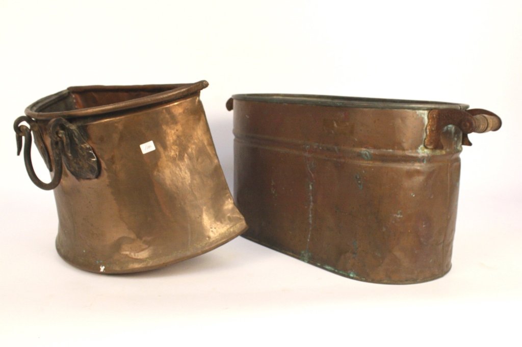 Set Copper Planter Pots with Wrought iron Hardware: Hammered and worn. Largest is oval with straight sides and measures 13h x 26w x 12d