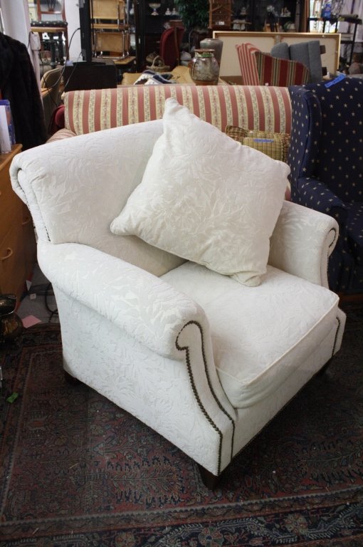 White Upholstered Easy Chair with Nail Head Trim: Includes matching Square shaped throw pillow.