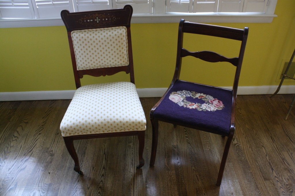 Lot of two Mixed Style Vintage Mahogany Chairs: One with Mother of pearl inlay floral design, fabric on back and seat in yellow floral upholstery. Casters and subtle cabriole curves on front legs only. 36-1/2h x 20w x 18d. 2nd chair needle point se