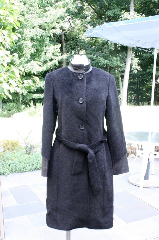 DALE DRESSIN Baby Llama and Leather: Black fur with black leather collar and cuff trim silk lined design label additional inside label read AMICALEROYALTYOF FRIBERS BABAY LLAMA Size 6-8 excellent condition
