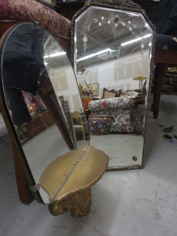 Two Antique Mirrors: Victorian style, first gold painted shelf and base, measures 17 inches tall by 10 inches wide, second carved frame, brass details, measures 23 inches tall by 11 inches wide