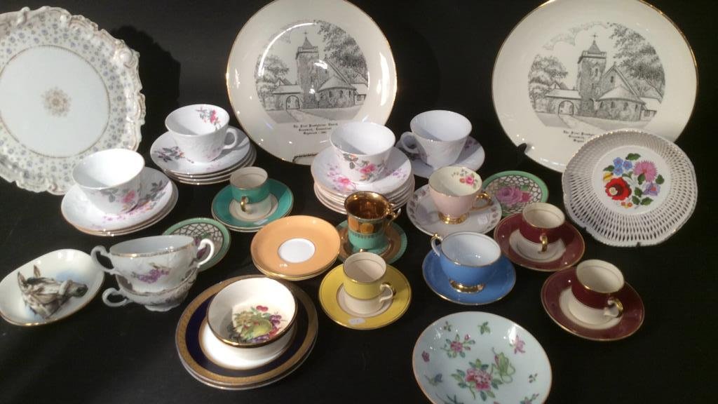 Group Lot Fine Porcelain Plates Platters Tea Cups: lot includes porcelain tea cups and saucers, platters bowls and more markings include royal falcon, Asian, Tiffany and co-small chips, Copeland Grosvenor, England, Limoges France, Spode and more. Prop