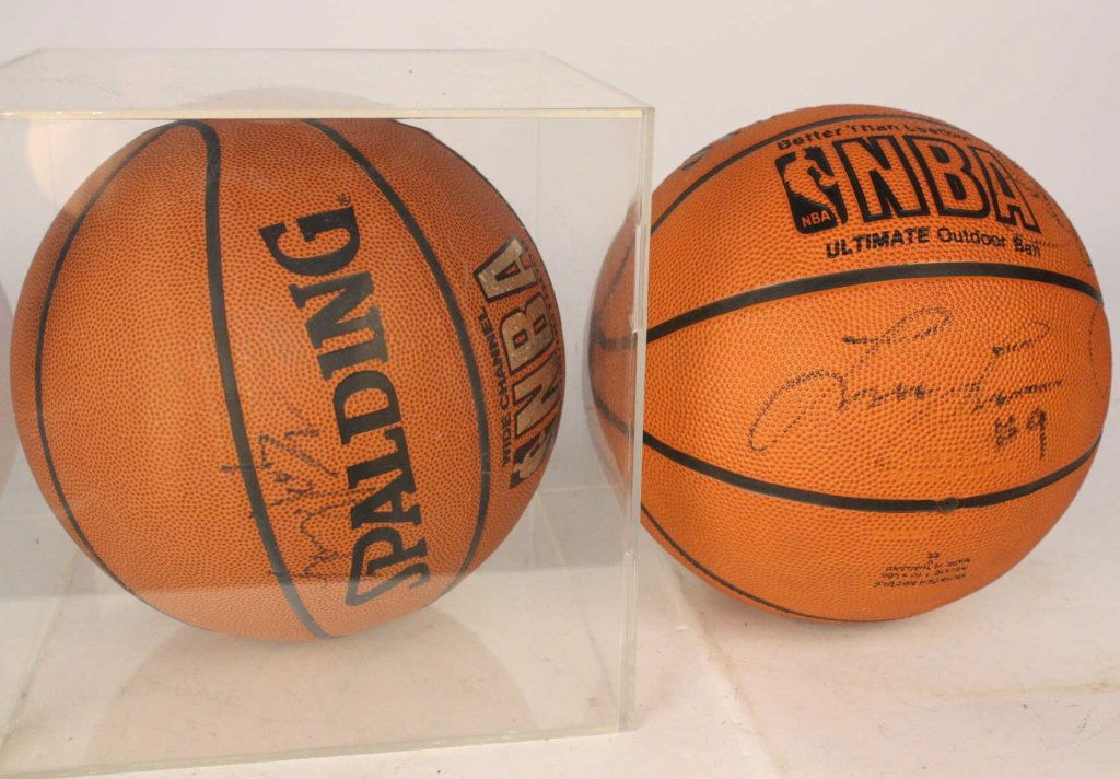 2 LARRY JOHNSON Signed Basket Balls: Larry Johnson New York Nicks number 2 signed Basket ball in Plexi glass box, and second signed Larry Johnson and other team mates basket ball. Consignor watched autographing.