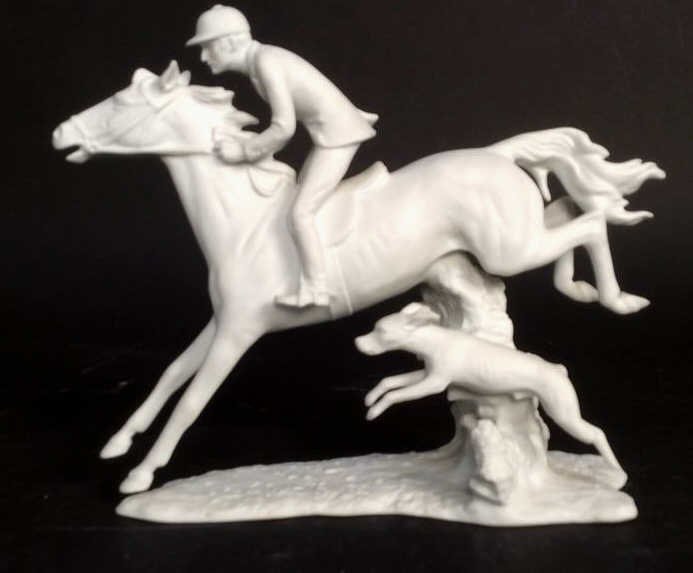 S.BOCHMANN Signed Porcelain Horse Sculpture: Porcelain sculpture of horse rider and dog. Chipped foot. Signed and marked on bottom for Kaiser Germany. Property of Greenwich Estate. Measures app height 9.5 inches, length 12 inches depth 3.5 inche