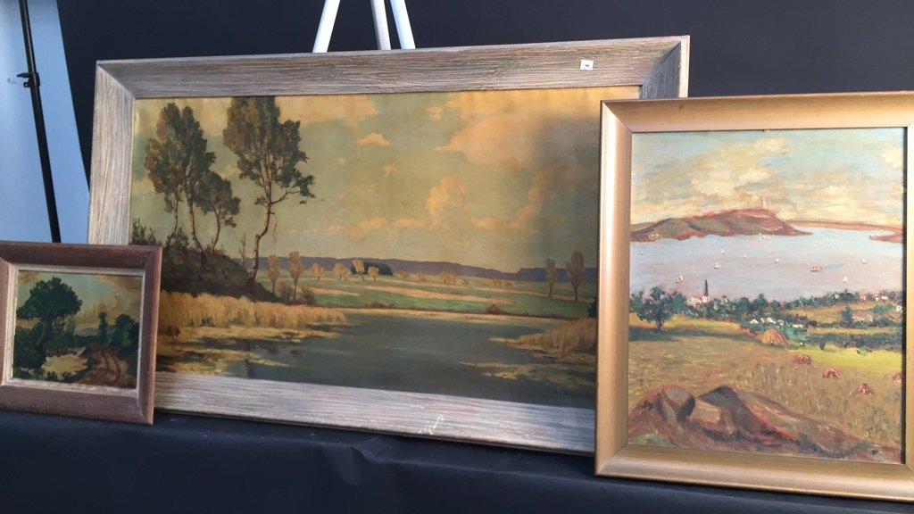 Group lot of 3 oil paintings on canvas: 2 signed FAULKENBURG country side landscapes with cloudy skies, a variety of trees and grassy knolls one near water. Similar soft pallet on largest signed F. Blode, all framed in wide wood style.