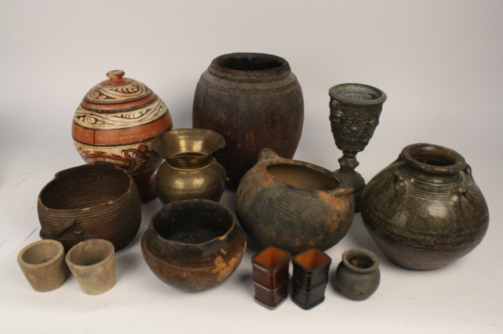 SURVIVOR TV Season 1 Props: Consigned by producer of Hit Tv Series SURVIVOR, group lot of Props from Season 1 includes pots one measures 18 inches height, jugs and island theme collectibles. primitives , metals, sterling and mor