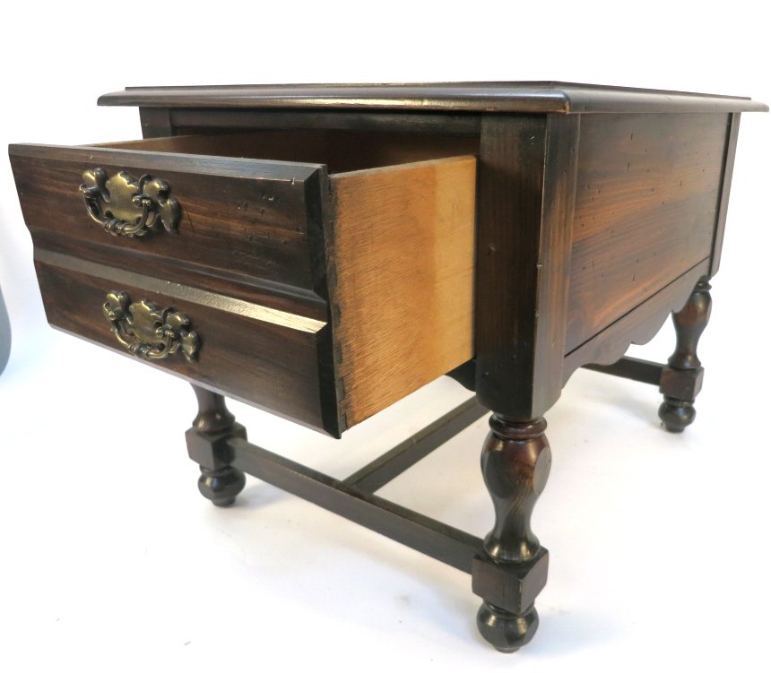 Dark Mahogany Nightstand with Turned Legs: Sing drawer with two bronze decorative handles and carved apron edge. Wear appropriate for age and use. Measures in inches 20h x 22w x 27d.