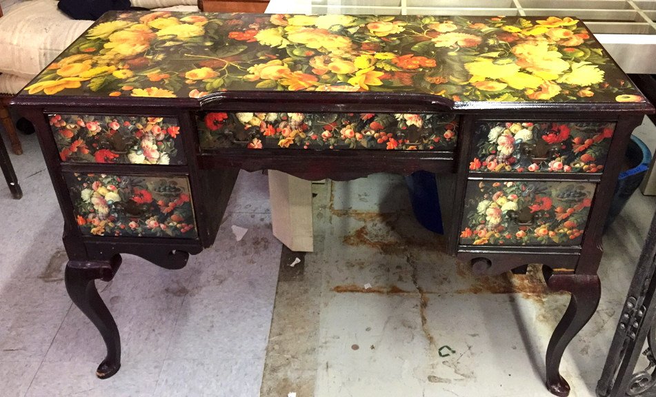 Vintage Mahogany Decoupage Petite Desk: Ladies bedroom or office writing desk with floral motif. Scrolled and scalloped edge design carved in apron. Cabriolet legs with five drawers. Dovetail drawer joins with bronze hardware. Measures 30 x