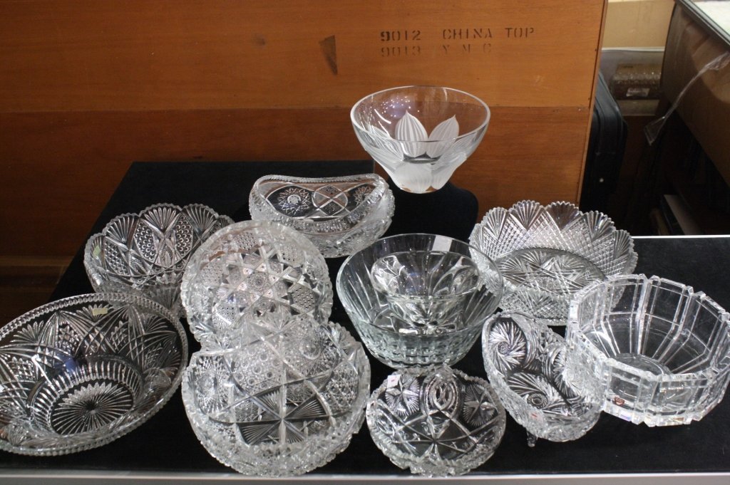 12 Piece Crystal and Glass Bowl Lot Group lot includes: Group lot includes both marked and unsigned crystal and glass vintage bowls, one signed ORREFORS SWEDEN, marked GC 4410-121, linear thick cut bowl, measures 4.5 inches tall by 8.5 inches in diameter, 