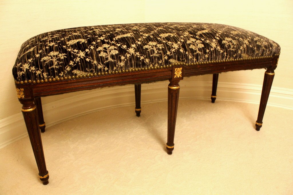 STARK FINE FURNITURE Louis upholstered bench: Carved wood Frame Bench with Animal Print cut velvet upholstery from Stark Fabric..The Louis bench is in Excellent Condition. Measures 18 inches deep, 21 inches high, 41 inches long. Property of a Bed