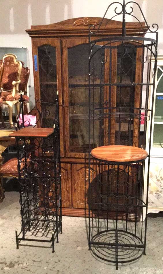 Pair of iron Wine holder racks This wine rack is: This wine rack is equipped with multiple rows and also has a table top above the racks this wine holder measures in at 54H x 12W . This lot also has a rack that can be used for holding wine as well as