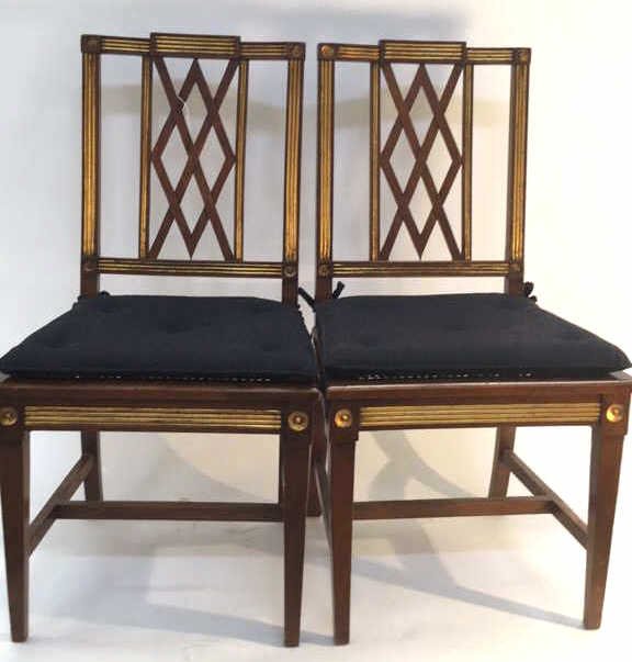 Pair of Two Mid Century Dinning Room Side Chairs: Federal style mid century chairs with straw bottom with blue padded seating on top trimmed in gold paint.