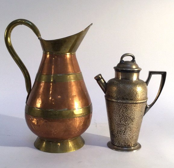 Two Iron Water Pitchers Vintage Style Two vintage old: Two vintage old fashion water pitchers one painted with a decorative pattern and one that was hand hammered.