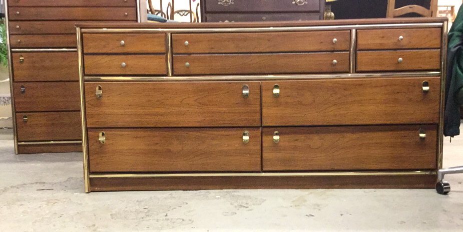 Set of dressers & nightstands SABINI'S Furniture: This is a set of mid century dressers with the largest one measuring in at 45.5H x 36W these dressers have a polished wooden look to them with the sides and handles trimmed in brass.