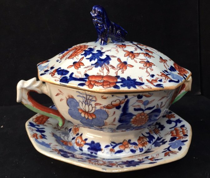 Antique Victorian Sauce Tureen & Cover c1820: A lovely antique 19th century Ironstone sauce tureen with cover and stand in cobalt blue, light blue and orange colors on a white background. There are green handles on either side of the piece and th