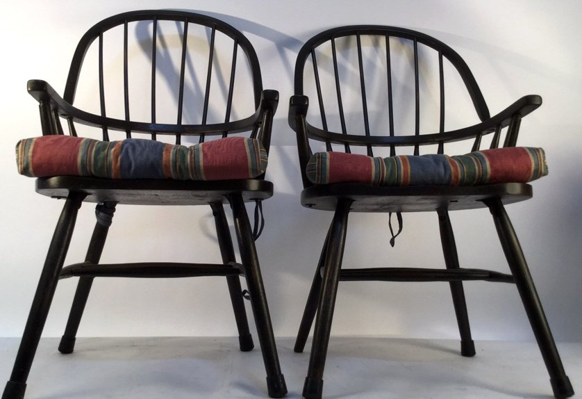 Pair of Black Windsor Kitchen Arm Chairs: Pair of Black Windsor kitchen arm chairs with a decorative colorful padding on the seat , rubber padding on end of legs on feet of chair, measures 38H x 21W